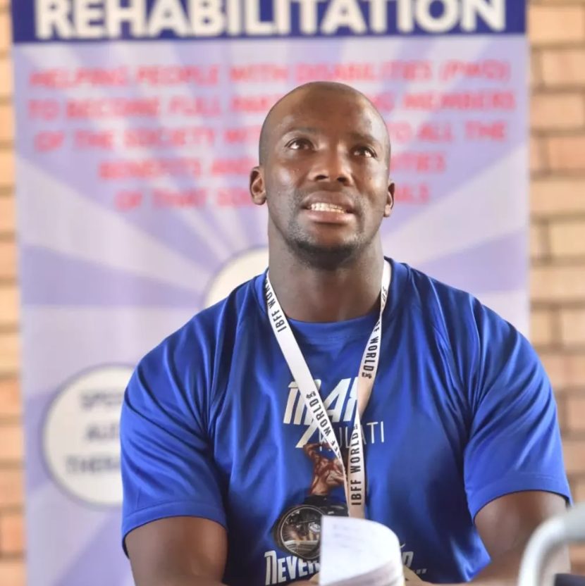 Max Kulati speaking at a community rehabilitation event