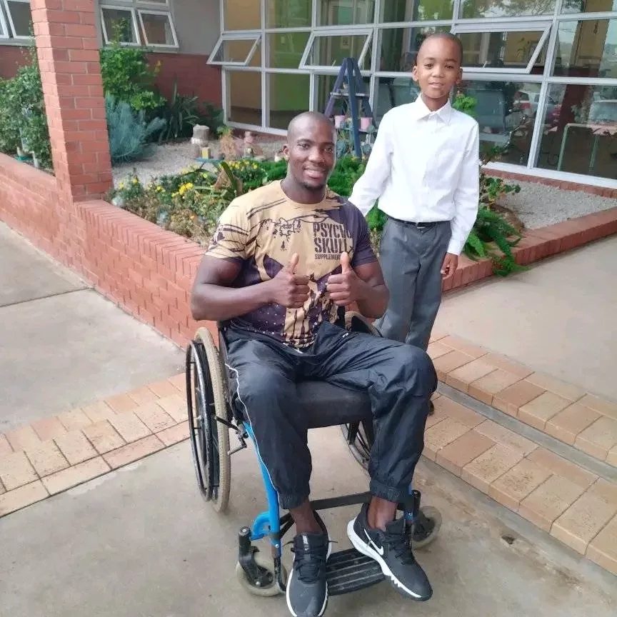 Macethandile 'Max' Kulati with his son on his first day at a new school — the man behind the champion